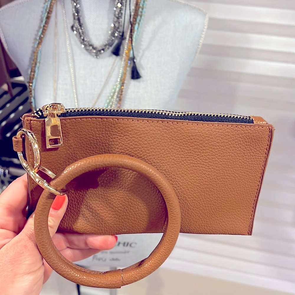 Adorable brand new vegan leather wristlet.